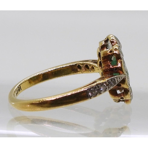 774 - An 18ct gold diamond and emerald ring, set with estimated approx 0.48cts of brilliant cut diamonds, ... 