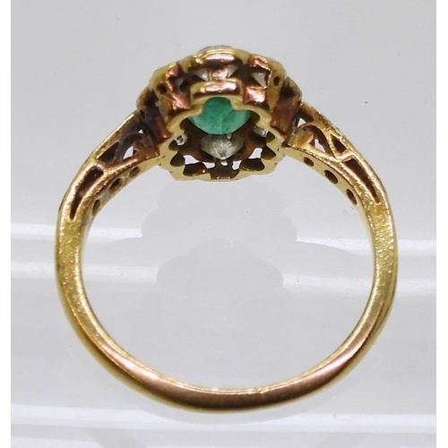 774 - An 18ct gold diamond and emerald ring, set with estimated approx 0.48cts of brilliant cut diamonds, ... 