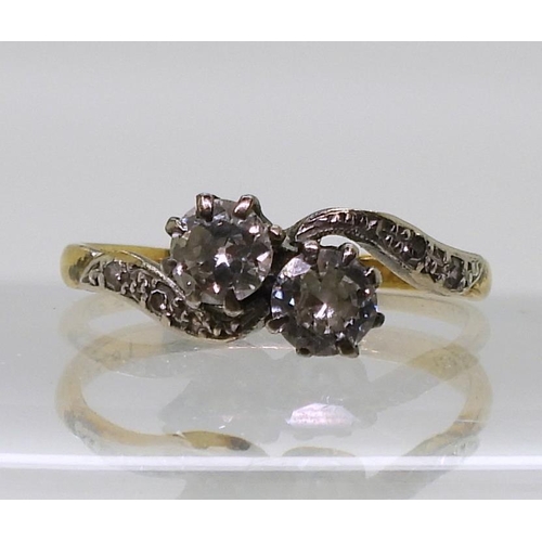 776 - An 18ct gold vintage twin stone diamond ring, set with estimated approx 0.30cts combined, finger siz... 