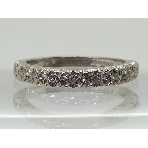 777 - An 18ct white gold illusion set eternity ring, size O1/2, weight 3.4gms