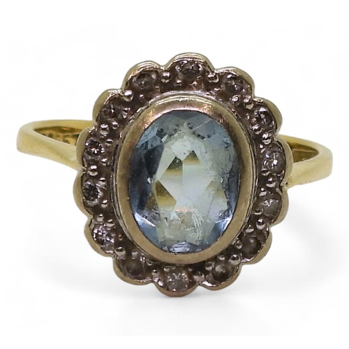 789 - An 18ct aquamarine and diamond cluster ring, size P, weight 4.2gms