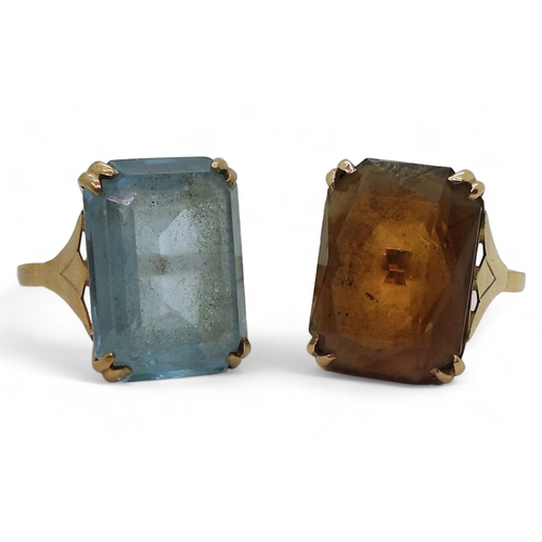 790 - Two identical 9ct gold ring mounts set with blue glass size P, with brown glass size R, weight combi... 