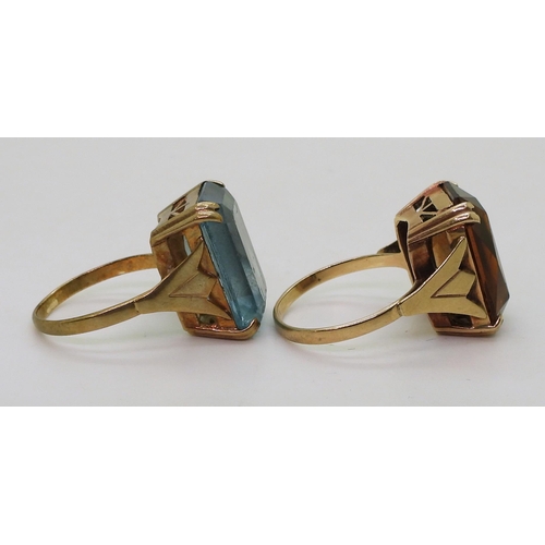 790 - Two identical 9ct gold ring mounts set with blue glass size P, with brown glass size R, weight combi... 