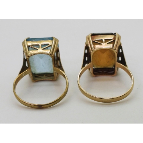 790 - Two identical 9ct gold ring mounts set with blue glass size P, with brown glass size R, weight combi... 