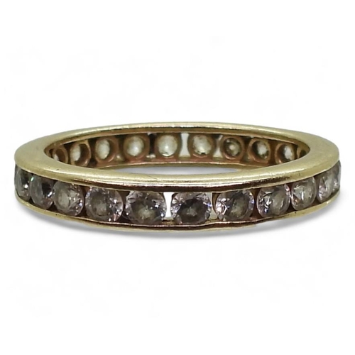 792 - A 14k gold full eternity ring set with cubic zirconia, finger size O, weight 2.8gms