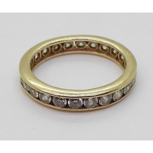 792 - A 14k gold full eternity ring set with cubic zirconia, finger size O, weight 2.8gms