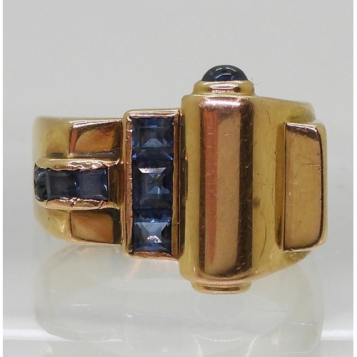 793 - A bright yellow metal Art Deco ring, set with sapphires finger size Q, weight 9.3gms