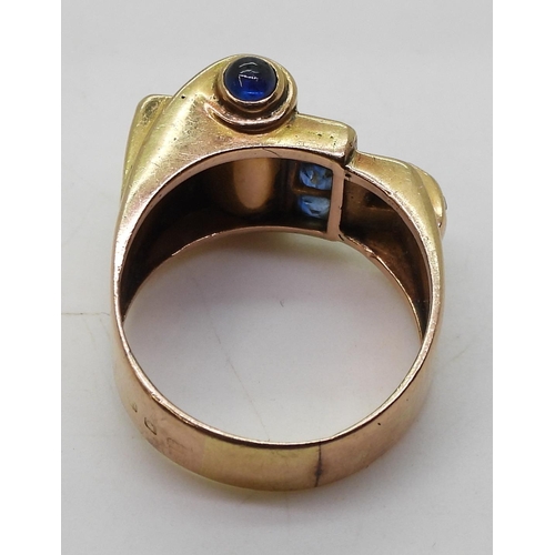 793 - A bright yellow metal Art Deco ring, set with sapphires finger size Q, weight 9.3gms