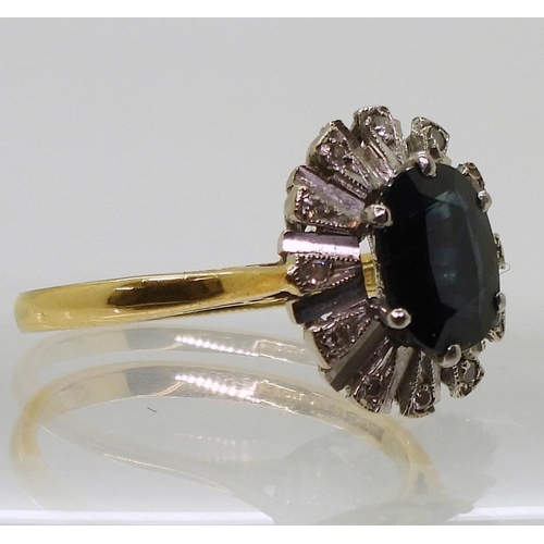 795 - An 18ct gold sapphire and diamond accent cluster ring, size R, weight 4.9gms