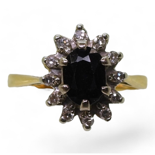 801 - An 18ct gold sapphire and diamond cluster ring, size L1/2, weight 4gms