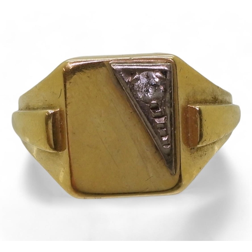 803 - A bright yellow metal signet ring set with a diamond, finger size Z1/2, weight 22.6gms