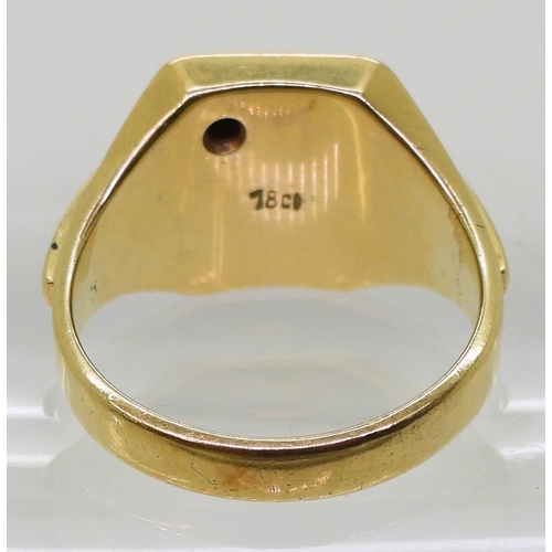 803 - A bright yellow metal signet ring set with a diamond, finger size Z1/2, weight 22.6gms