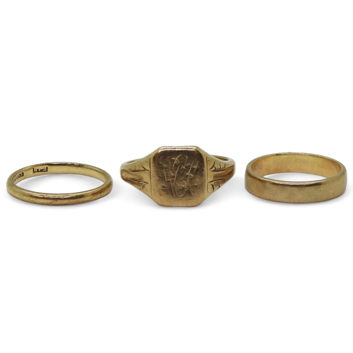 807 - Two 9ct gold wedding rings, both size J, and a 9ct signet ring, size O, weight combined 6.6gms