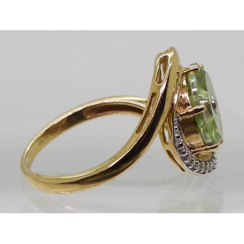 808 - A 9ct gold Glen Lehrer fern green torus ring set with a central diamond and surrounded with a cresce... 