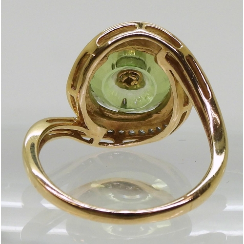 808 - A 9ct gold Glen Lehrer fern green torus ring set with a central diamond and surrounded with a cresce... 