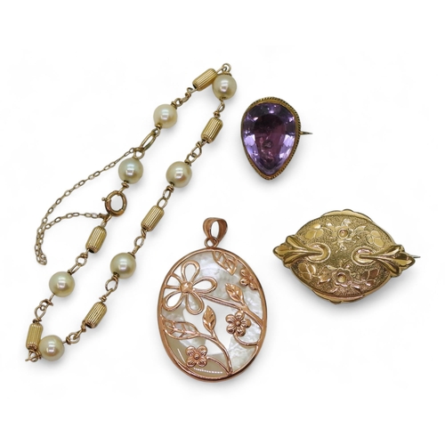 810 - A 9ct rose gold and mother of pearl pendant, an amethyst brooch mounted in yellow metal, and a yello... 