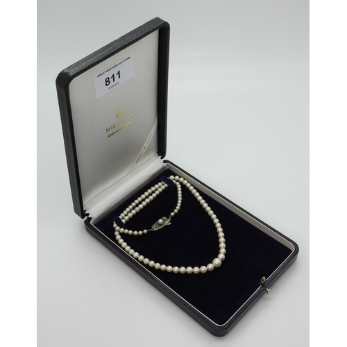 811 - A 46cm string of Mikimoto pearls with silver pearl set Mikimoto branded clasp, in original box large... 