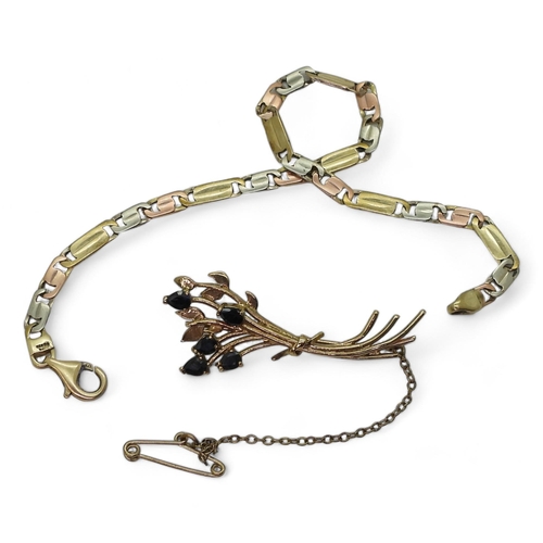 825 - A three colour gold bracelet, length 19.5cm, and a 9ct gold sapphire brooch, length 4.5cm, weight 9g... 