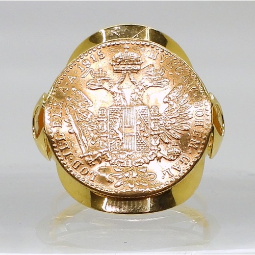 850 - A 14k gold ring with a soldered on 1915 Bohemian Ducat coin, finger size R, weight 6.3gms