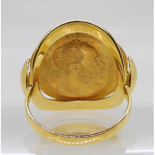 850 - A 14k gold ring with a soldered on 1915 Bohemian Ducat coin, finger size R, weight 6.3gms