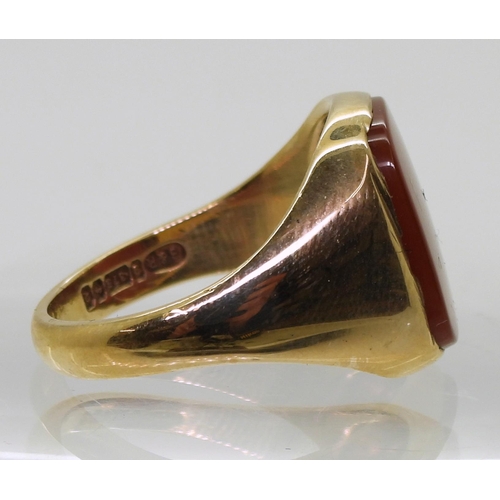 852 - A 9ct gold carnelian set signet ring, size W, weight 8.7gms