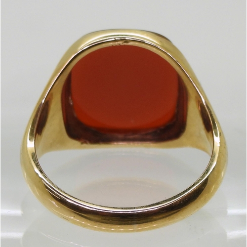 852 - A 9ct gold carnelian set signet ring, size W, weight 8.7gms