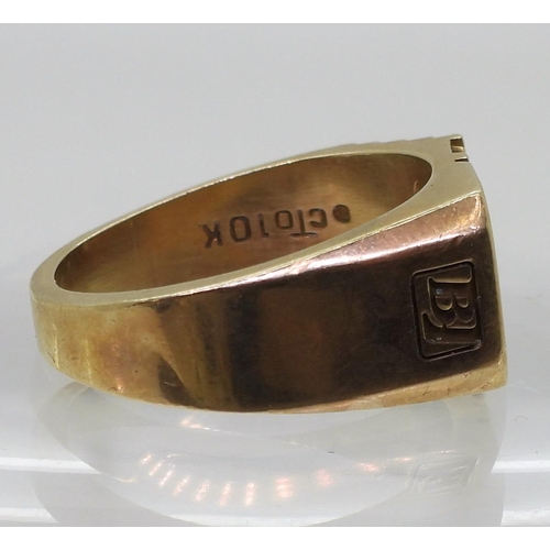 855 - A 10K gold signet ring, set with three diamonds with an estimated approx total of 0.10cts , finger s... 