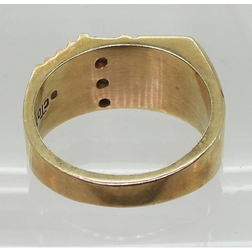 855 - A 10K gold signet ring, set with three diamonds with an estimated approx total of 0.10cts , finger s... 