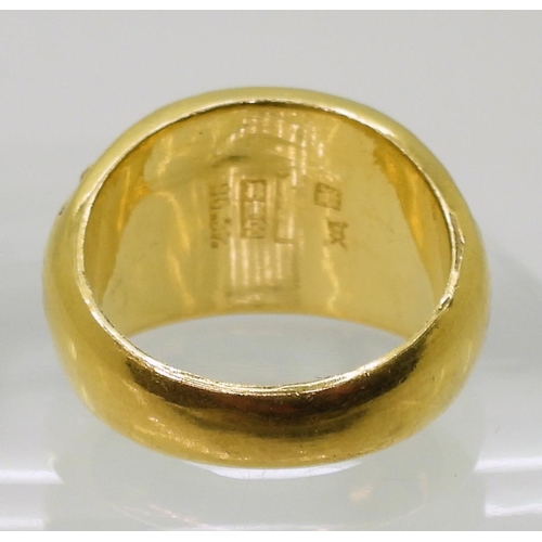 859 - A bright yellow metal ring, stamped with Chinese characters and 996.5%, finger size U, weight 15.1gm... 