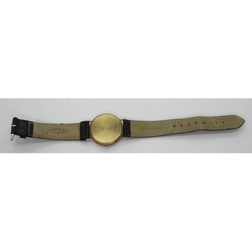 874 - A 9ct gold Rotary Elite watch, with black leather strap, weight 24.6gms