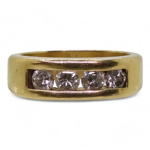 883 - A bright yellow metal ring set with four diamonds with an estimated approx diamond total of 0.80cts,... 