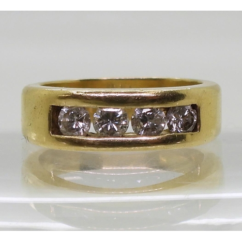 883 - A bright yellow metal ring set with four diamonds with an estimated approx diamond total of 0.80cts,... 