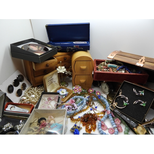 898 - A large quantity of vintage costume jewellery to include, good bead necklaces, two miniature chests ... 