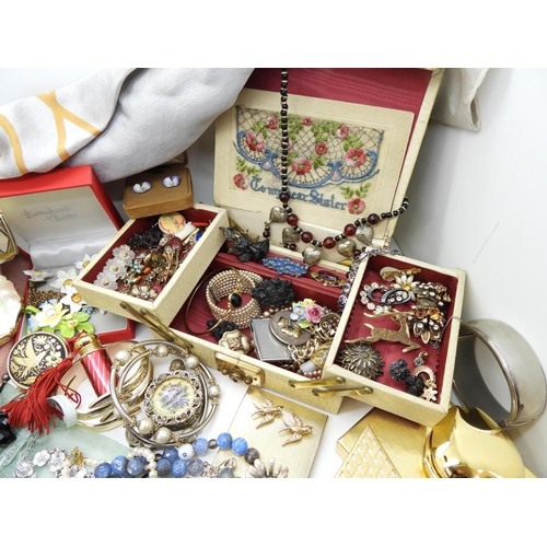 900 - A large collection of vintage costume jewellery and compacts to include a triangular Faberge compact... 