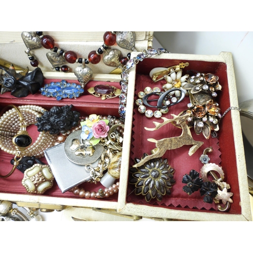 900 - A large collection of vintage costume jewellery and compacts to include a triangular Faberge compact... 