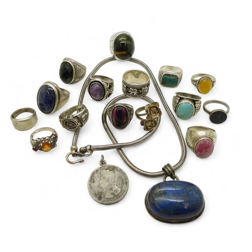 918 - A collection of silver and white metal jewellery with a large lapis lazuli pendant, a Thai coin with... 