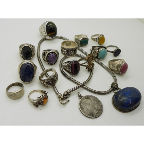 918 - A collection of silver and white metal jewellery with a large lapis lazuli pendant, a Thai coin with... 