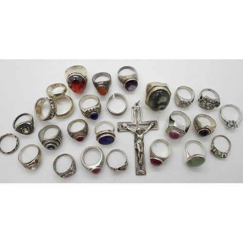 919 - A large white metal crucifix, and a collection of silver and white metal rings to include rutilated ... 