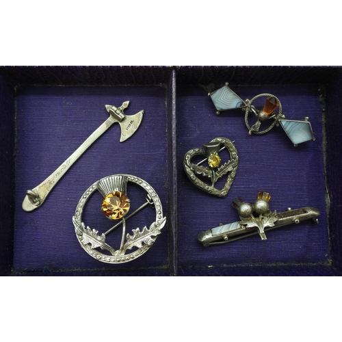 926 - Scottish themed jewellery to include an Iain MacCormick, pen annular brooch, a further example by Wa... 