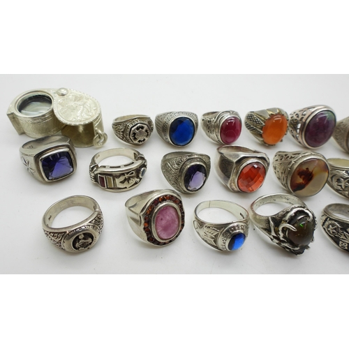 929 - A collection of silver and white metal gem set rings to include ruby-zoisite, agate, turquoise, opal... 