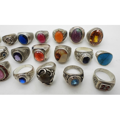 929 - A collection of silver and white metal gem set rings to include ruby-zoisite, agate, turquoise, opal... 