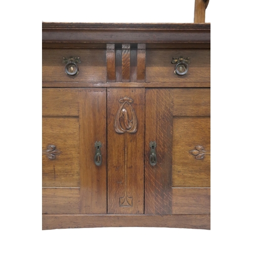 2040 - AN  OAK ARTS & CRAFTS MIRROR BACK SIDEBOARD bevelled mirror back flanked by glazed cabinets on s... 