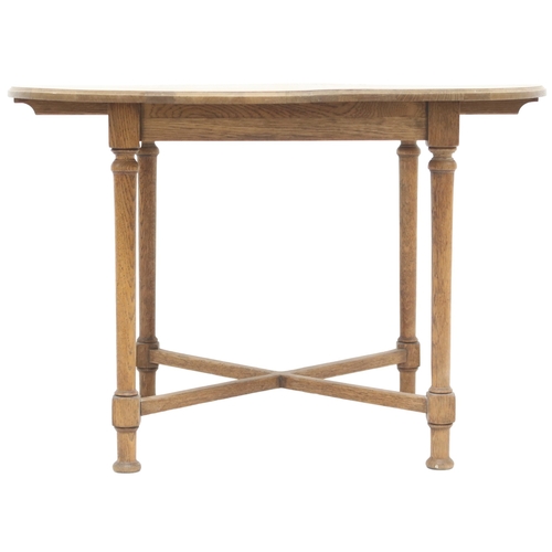 2041 - AN OAK ARTS & CRAFTS BREAKFAST TABLE with circular top on turned supports joined by crossed stre... 