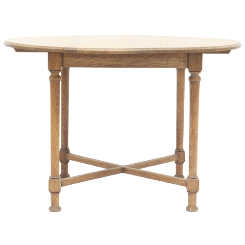 2041 - AN OAK ARTS & CRAFTS BREAKFAST TABLE with circular top on turned supports joined by crossed stre... 