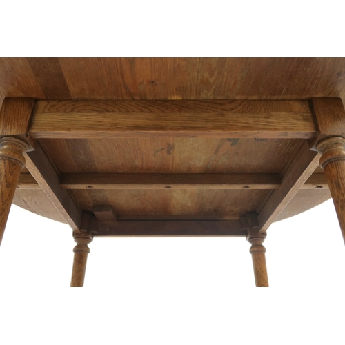 2041 - AN OAK ARTS & CRAFTS BREAKFAST TABLE with circular top on turned supports joined by crossed stre... 