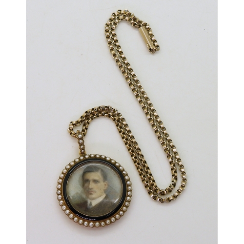 2793 - A 15CT PORTRAIT MINIATURE PENDANTthe portrait of a young man, is encircled with black enamel and pea... 