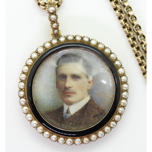 2793 - A 15CT PORTRAIT MINIATURE PENDANTthe portrait of a young man, is encircled with black enamel and pea... 