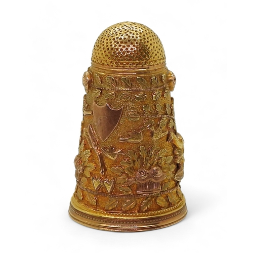 2803 - A DECORATIVE THIMBLEin bright yellow metal with rose gold embellished Cherubs, birds, roses  an... 