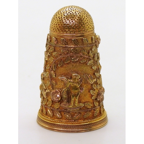 2803 - A DECORATIVE THIMBLEin bright yellow metal with rose gold embellished Cherubs, birds, roses  an... 