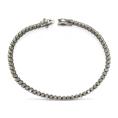 2813 - A DIAMOND LINE BRACELETmounted in 9ct white gold, set with sixty-two x 0.025ct brilliant cut diamond... 